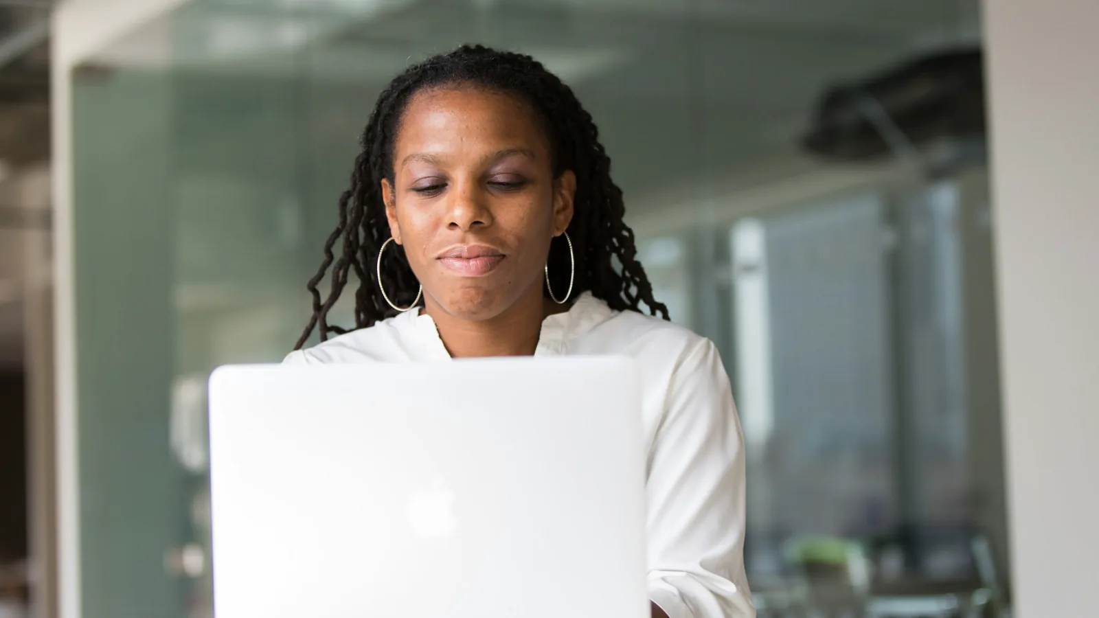 Professional woman working at her desk during perimenopause